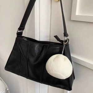 Minimalist black lychee pattern leather shoulder bag with white plush ball charm