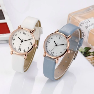 Elegant women's quartz watches with leather straps and rose gold cases on a white background