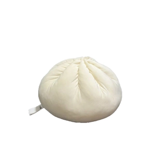 Steamed bun plush pillow made of soft cream-white fabric for cozy home decoration