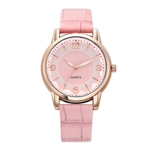 Detail of pink leather strap and rose gold quartz watch dial with minimalist markers