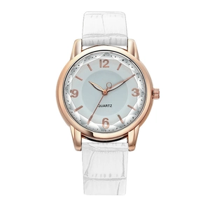 Detail view of women's quartz watch with rose gold case and faceted crystal glass
