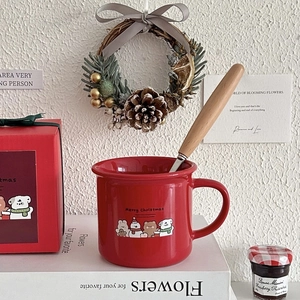 Festive red ceramic mug gift set with wooden handle spoon and Merry Christmas cartoon design