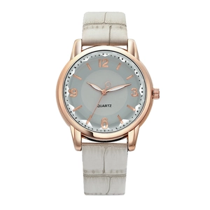 Detailed view of rose gold quartz watch featuring a gray alligator texture leather strap