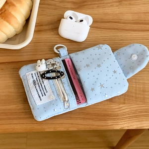 Detailed view of light blue star pattern mini pouch with card slots and zipper pocket