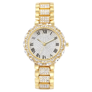 Detailed macro of a gold luxury women's watch with full crystal inlay and Roman numerals