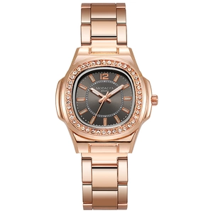 Macro view of the rose gold octagonal bezel set with rhinestones on the quartz watch