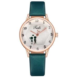 Detailed close-up of a minimalist quartz watch with green strap and rose gold case