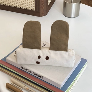 Detailed view of canvas puppy pencil case with cute ears and premium metal zipper
