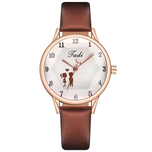 Detail of rose gold watch case with white sunburst dial and brown leather strap