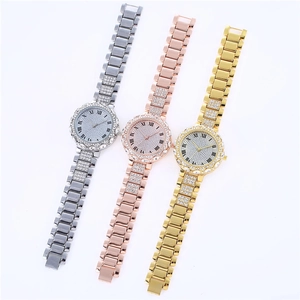 Close-up of three women's quartz watches with crystal-set dials and Roman numerals