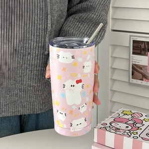 Detail of pink stainless steel tumbler featuring cute cartoon cat patterns and metal straw
