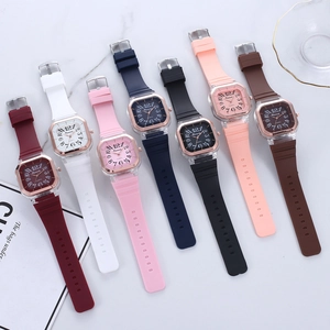 Square quartz watch with silicone strap in seven colors on marble background