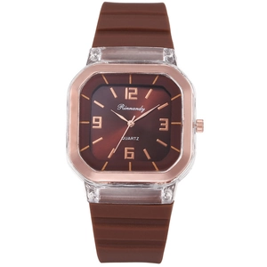 Detailed macro view of the Rinnandy quartz watch dial with rose gold markers and brown strap