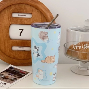 Detail view of light blue steel tumbler featuring cute watercolor cat illustrations and straw