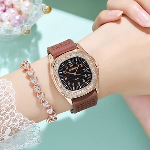 Close-up of luxury square quartz watch with rhinestone bezel and silicone strap