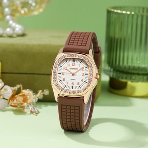 Detailed macro view of square rose gold watch case with sparkling crystal bezel