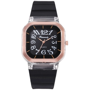 Detail of square quartz watch featuring a rose gold inner ring and black silicone strap