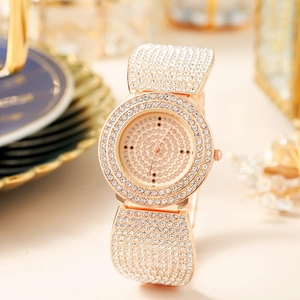 Close-up of rose gold luxury watch with high-density rhinestones on dial and bezel