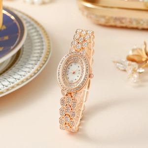 Orologio da donna di lusso al quarzo in oro rosa con quadrante ovale e maglie in strass
