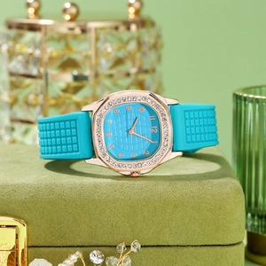 Detail of rose gold rhinestone watch with sky blue silicone strap and velvet box