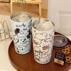 Detail view of cartoon dog stainless steel tumblers with ice cubes and transparent lids