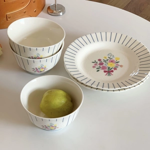 Vintage floral ceramic tableware set with blue stripes and elegant bow pattern detail