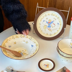 Detailed view of Little Prince ceramic tableware set including bowls and plates