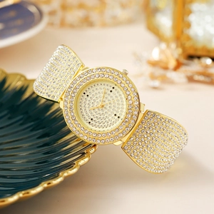 Luxurious gold-tone women's watch with shimmering rhinestones and a metal band
