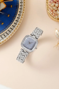 Close-up of elegant square silver women's watch with full rhinestone embellishment