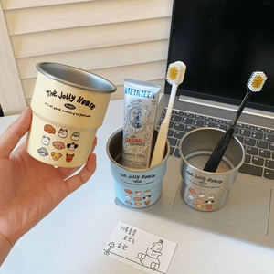 Detail of cute cartoon dog tooth mugs with stainless steel lining and doggy prints