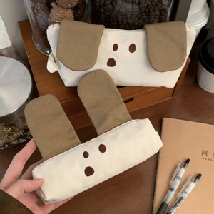 Close-up of cute canvas pencil case with 3D dog ears and embroidered details
