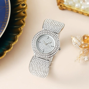 Elegant silver women's quartz watch with full rhinestones on pink decorative background