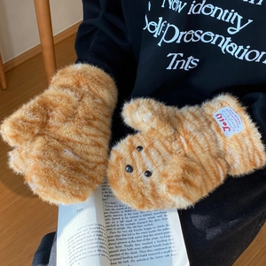 Detail of plush tiger-stripe mittens with cat-shaped design and warm faux fur texture