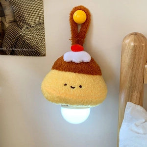 Hanging cartoon pudding plush night light shown decorating a cozy bedroom wall