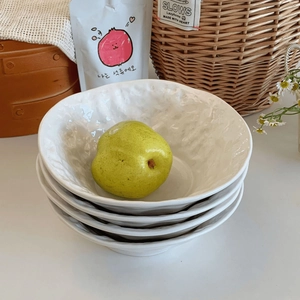 Set of four white ceramic bowls with rocky texture finish for soup and salad