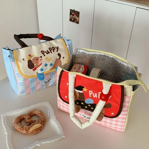 Detail of dachshund lunch bags showing insulated aluminum foil lining and plaid pattern