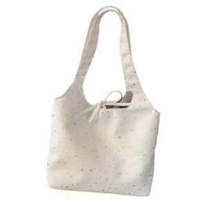 White canvas tote bag with silver star prints and tie closure for women