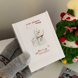 White Christmas gift box featuring snowman illustration and Merry Christmas text