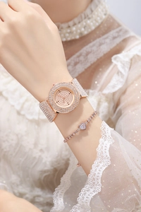 Close-up of rose gold rhinestone watch set with matching heart diamond bracelet