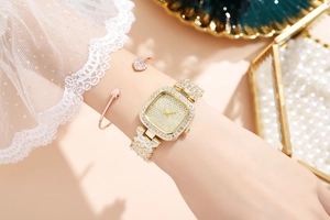 Elegant square rhinestone quartz watch for women shown in detail on wrist with bangle