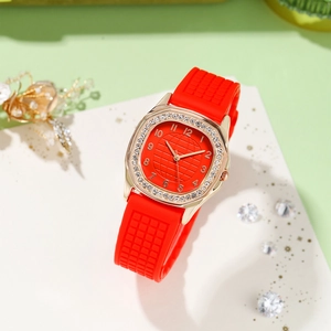 Detail of red globe pattern dial with rhinestone gold tonneau case on women quartz watch