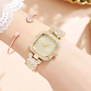 Elegant gold-tone square watch with full rhinestone bezel and dial worn on wrist