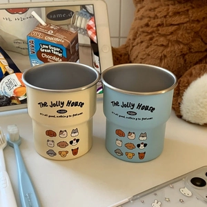 Detail of insulated puppy mugs with stainless steel lining in blue and beige