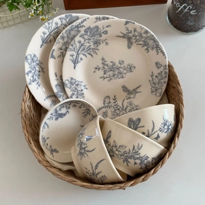 French vintage ceramic dinnerware set with blue floral patterns and bird motifs