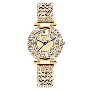 Dettaglio dell'orologio di lusso dorato da donna con diamanti scintillanti e quadrante
