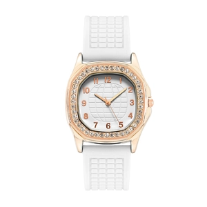 Macro detail of square rose gold rhinestone watch case with white textured rubber strap