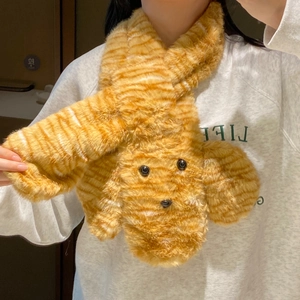 Detailed view of plush orange tiger striped scarf featuring a cute puppy design