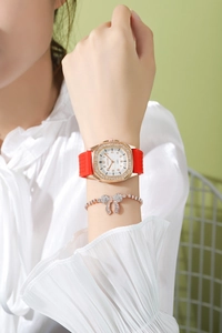 Close-up of red silicone watch with rhinestone bezel and matching bow bracelet set