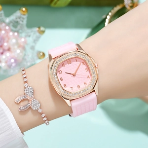 Women's quartz watch with rhinestones and pink silicone strap, plus crystal bow bracelet