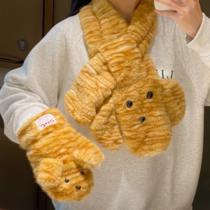 Close-up of plush ginger tiger stripe scarf and gloves set with cute 3D dog head design